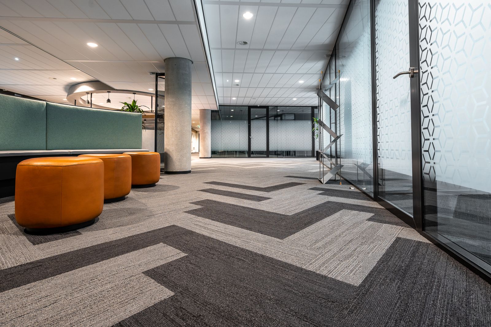 Freshly cleaned commercial carpet tile in a bright office corridor